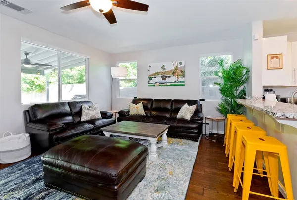 a living room with furniture fireplace and window