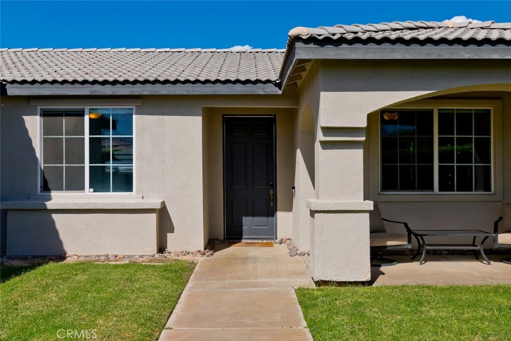 80750 Diamondback Trail Indio, CA 92201 - Photo 2 of 67 a house view with a garden space