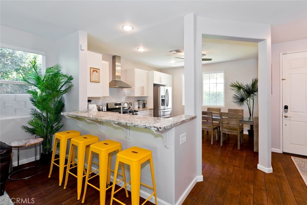 80750 Diamondback Trail Indio, CA 92201 - Photo 24 of 67 a view of a dining room kitchen with furniture and wooden floor