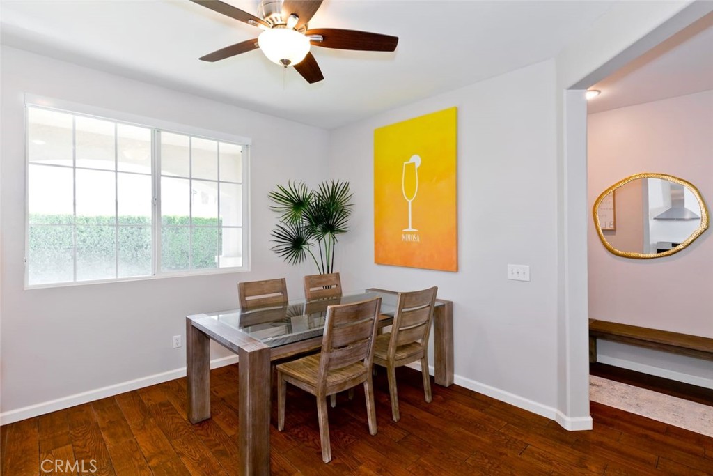 80750 Diamondback Trail Indio, CA 92201 - Photo 26 of 67 a dining room with furniture a window and wooden floor