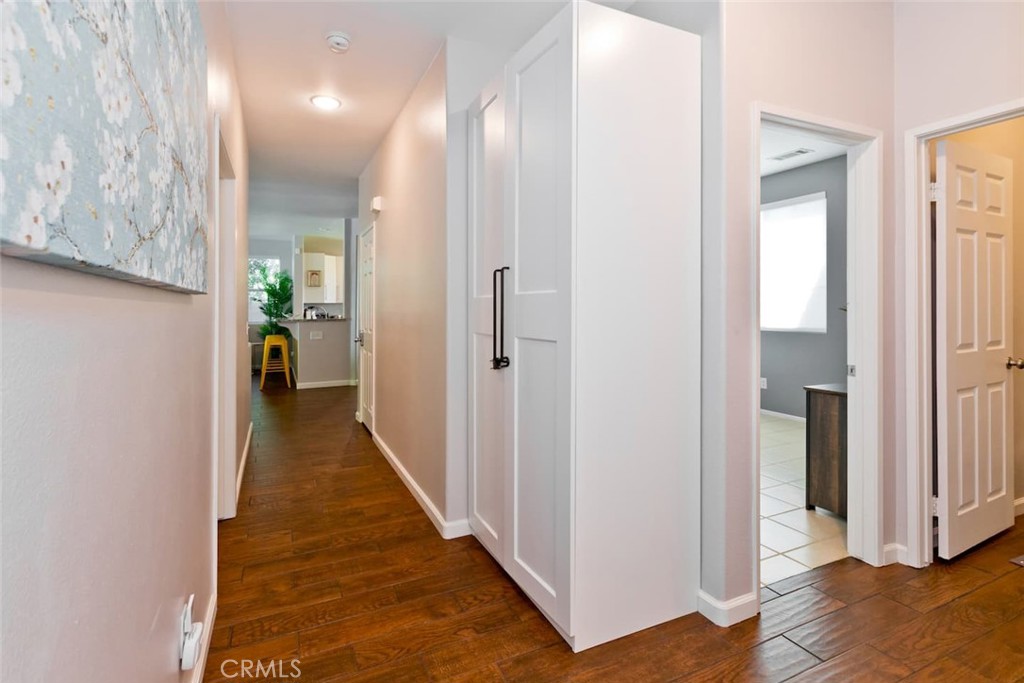 80750 Diamondback Trail Indio, CA 92201 - Photo 27 of 67 a hallway with white doors wooden floor and stairs