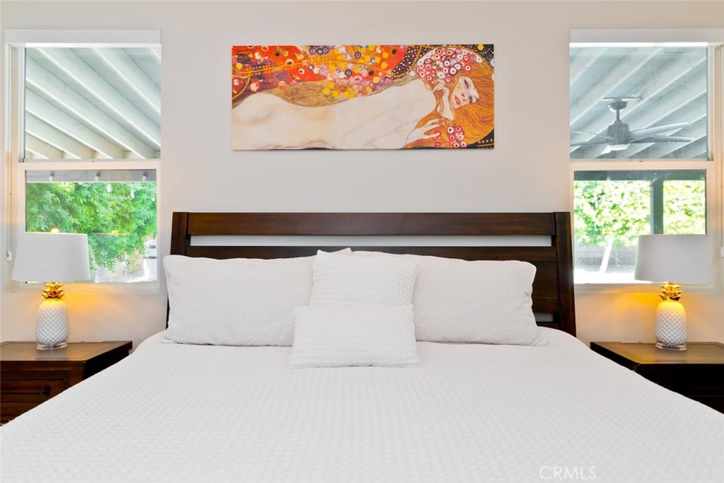 80750 Diamondback Trail Indio, CA 92201 - Photo 29 of 67 a bedroom with a bed and wooden floor