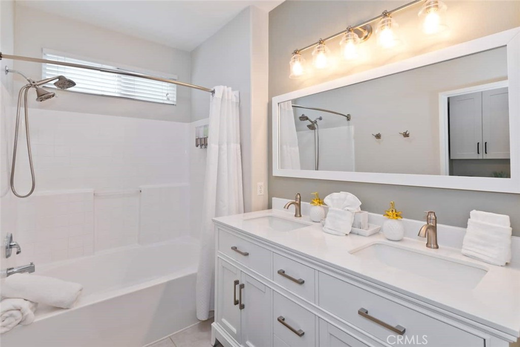 80750 Diamondback Trail Indio, CA 92201 - Photo 34 of 67 a bathroom with a granite countertop sink mirror and a bathtub