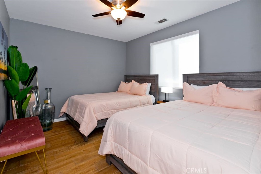 80750 Diamondback Trail Indio, CA 92201 - Photo 40 of 67 a bedroom with two beds and a potted plant