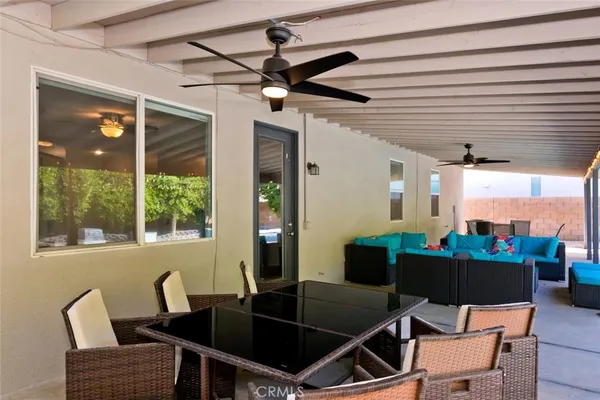 a outdoor living space with lots of furniture and garden view