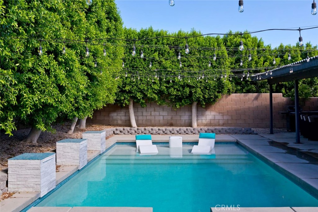 80750 Diamondback Trail Indio, CA 92201 - Photo 45 of 67 a backyard of a house with table and chairs