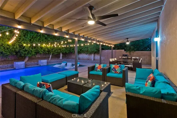 a view of a chairs and table in the patio