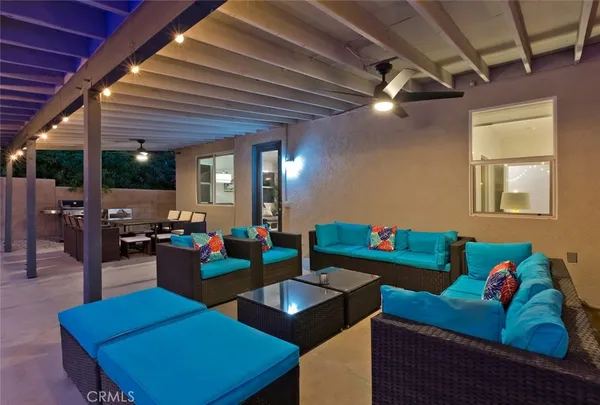 a view of a backyard with swimming pool