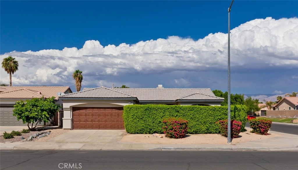 80750 Diamondback Trail Indio, CA 92201 - Photo 8 of 67 a front view of a house with a yard
