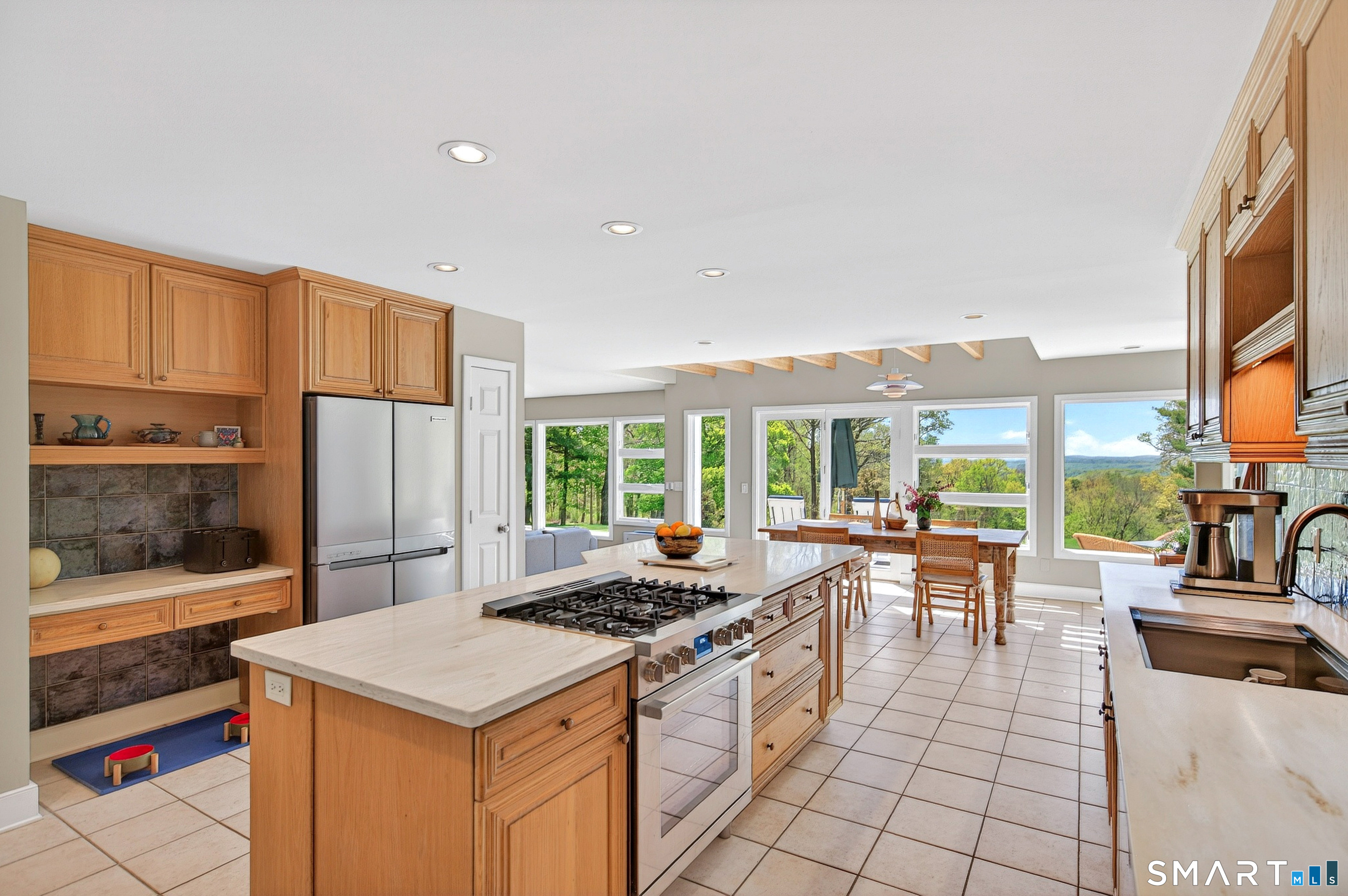 140 2nd Hill Road Bridgewater, CT 06752 - Photo 14 of 40 a kitchen with stainless steel appliances a stove a refrigerator a kitchen island a stove and a refrigerator