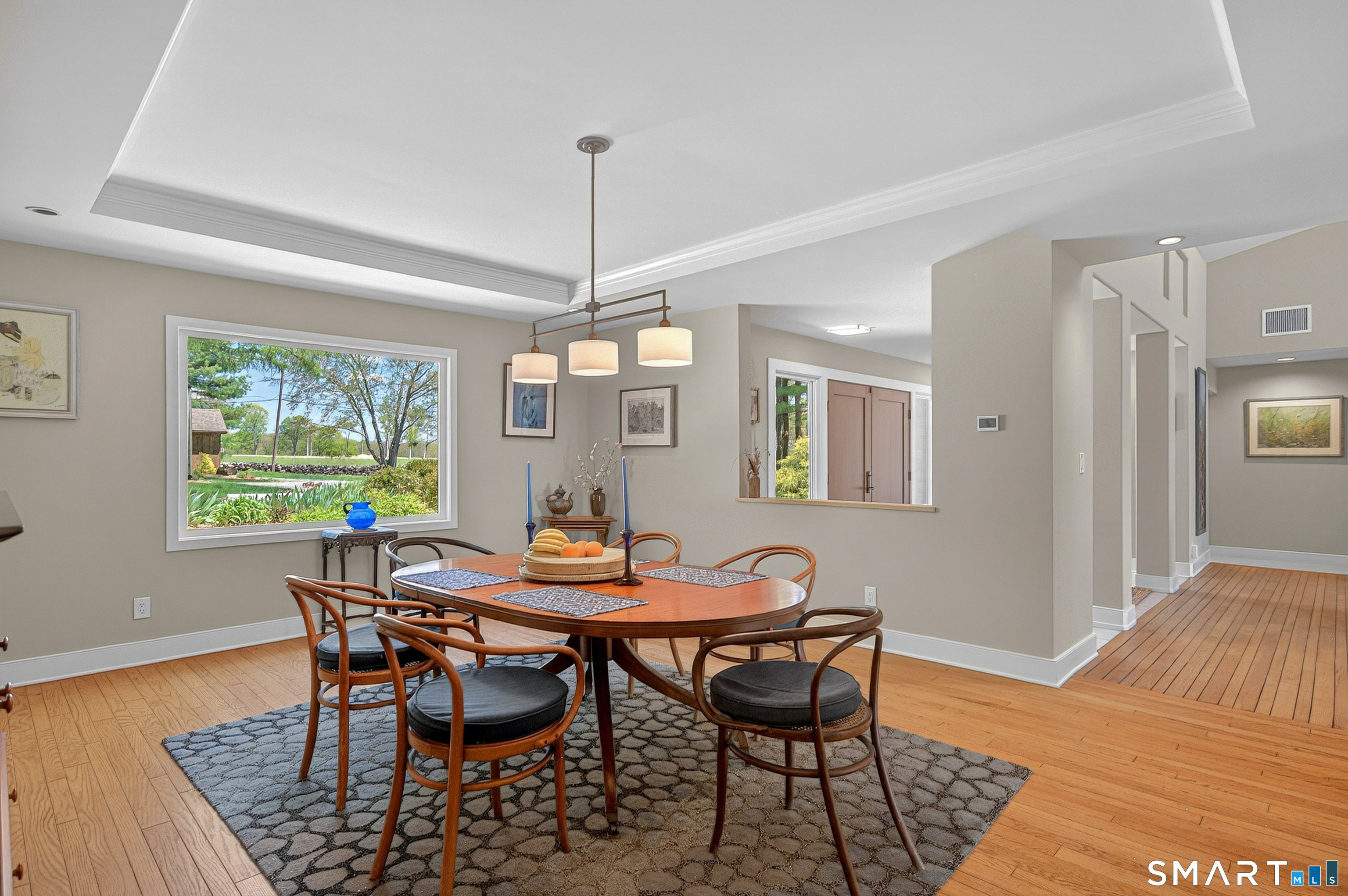 140 2nd Hill Road Bridgewater, CT 06752 - Photo 16 of 40 a view of a dining room with furniture a rug and wooden floor