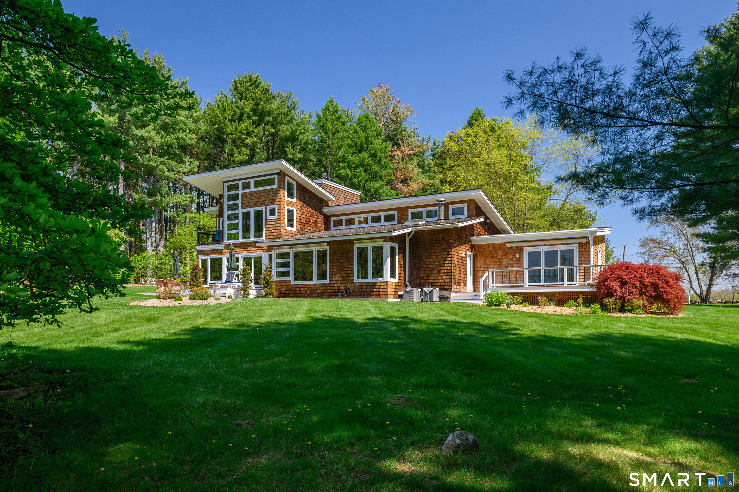 140 2nd Hill Road Bridgewater, CT 06752 - Photo 18 of 40 a front view of a house with a garden