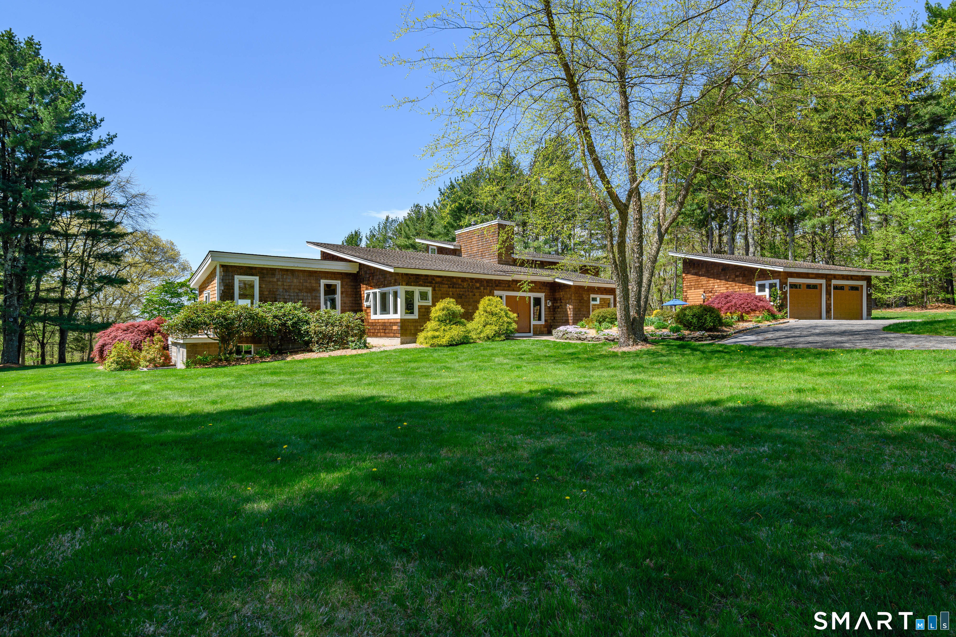 140 2nd Hill Road Bridgewater, CT 06752 - Photo 19 of 40 a view of a house with a big yard and large trees