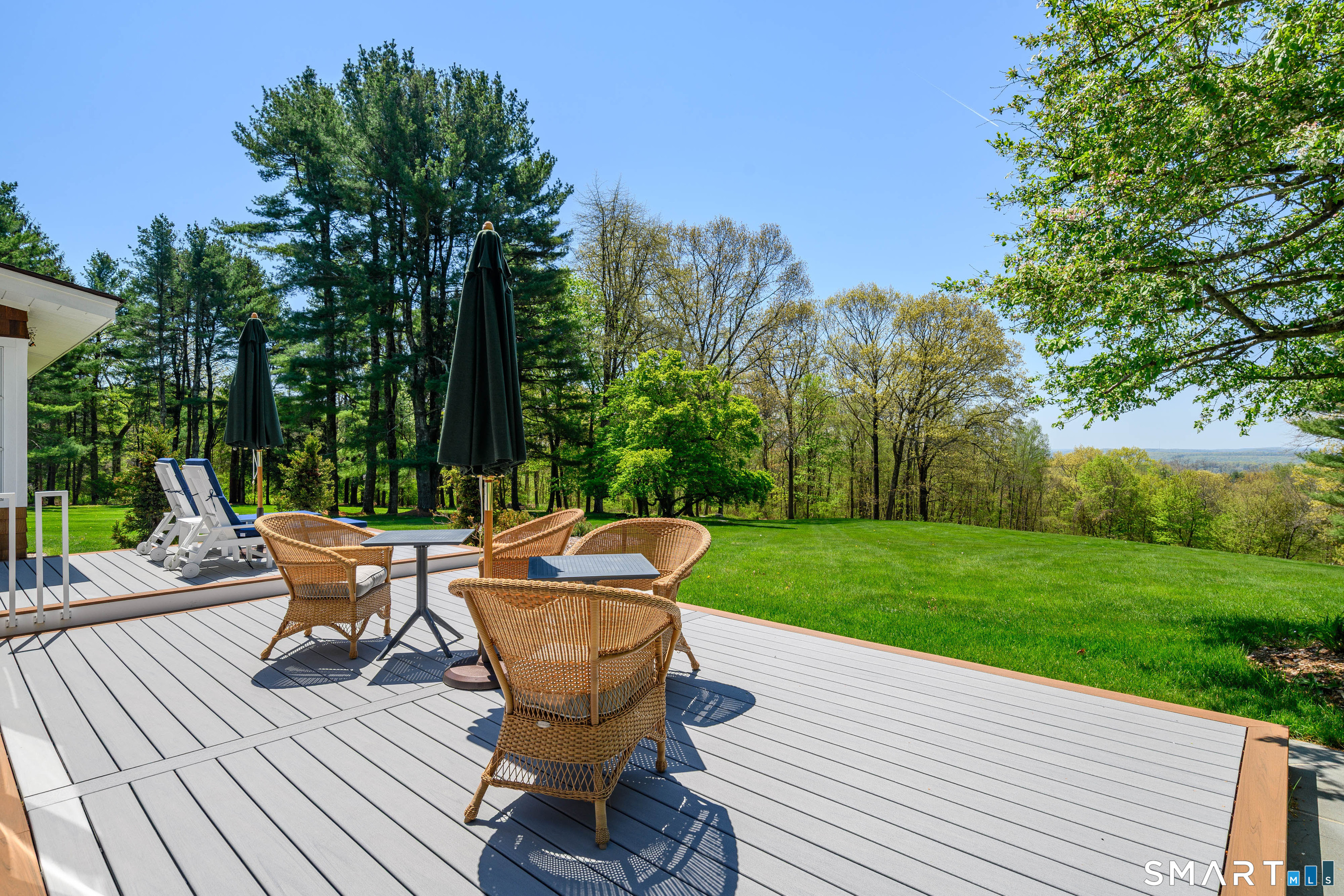 140 2nd Hill Road Bridgewater, CT 06752 - Photo 2 of 40 a wooden bench sitting in the middle of a backyard