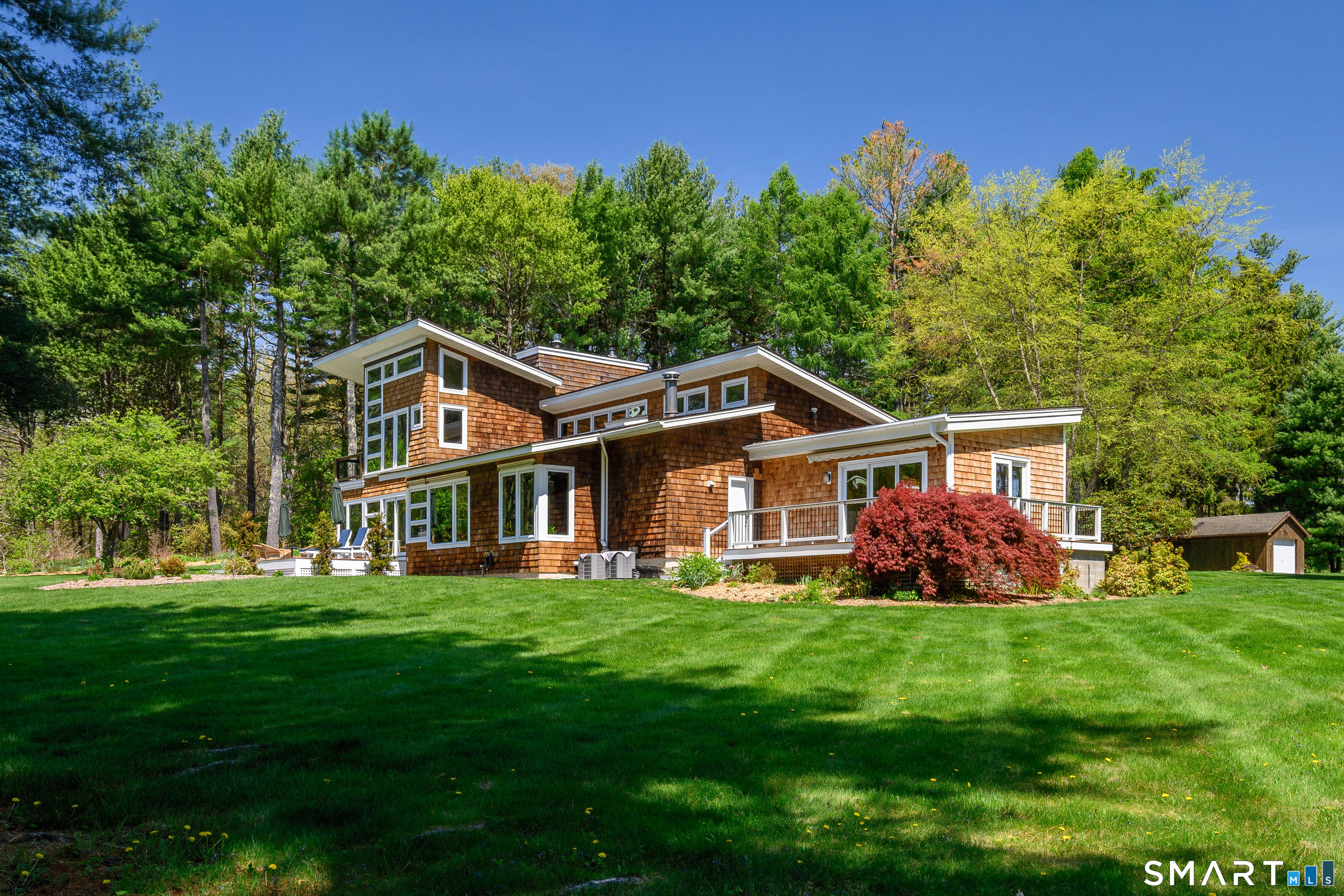 140 2nd Hill Road Bridgewater, CT 06752 - Photo 32 of 40 a front view of a house with a yard and trees