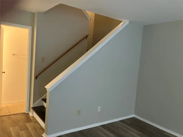 a view of balcony with wooden floor
