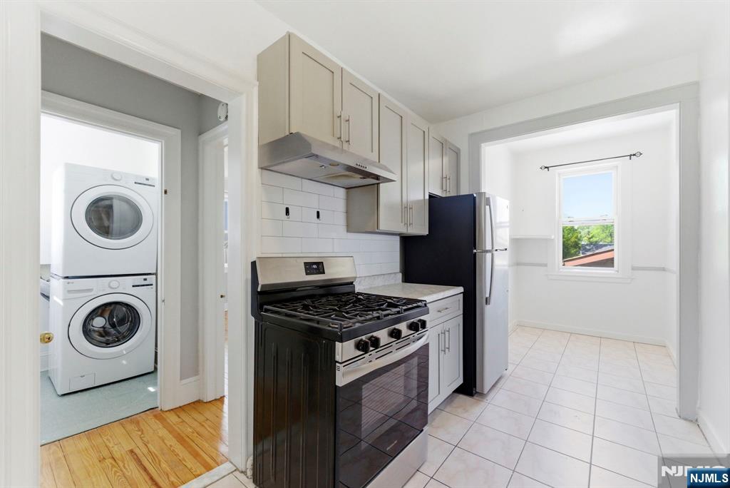 773 Kingsland Avenue Ridgefield, NJ 07657 - Photo 4 of 13 a kitchen with stainless steel appliances granite countertop a stove a refrigerator and a sink