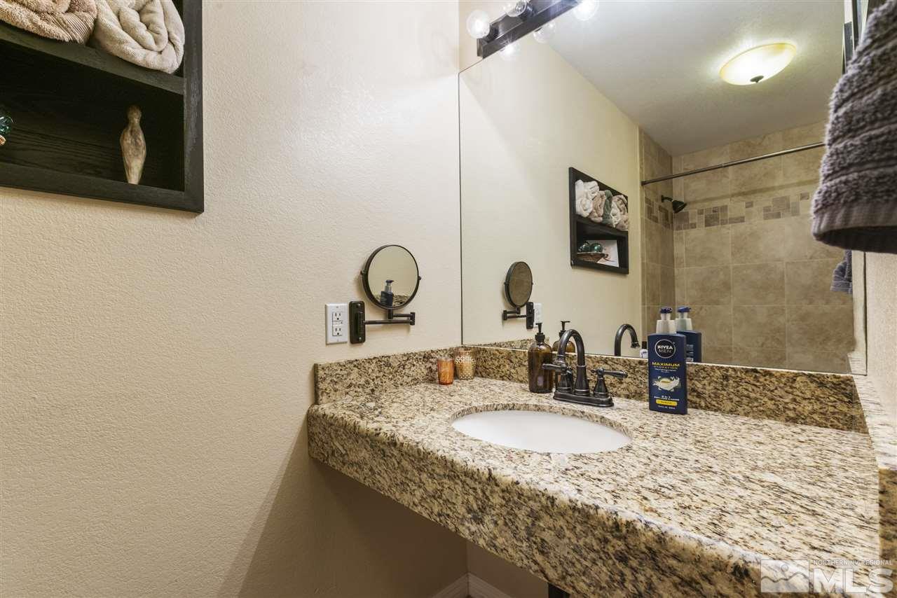 1545 Elizabeth Street Reno, NV 89509 - Photo 15 of 21 a bathroom with a sink and a mirror