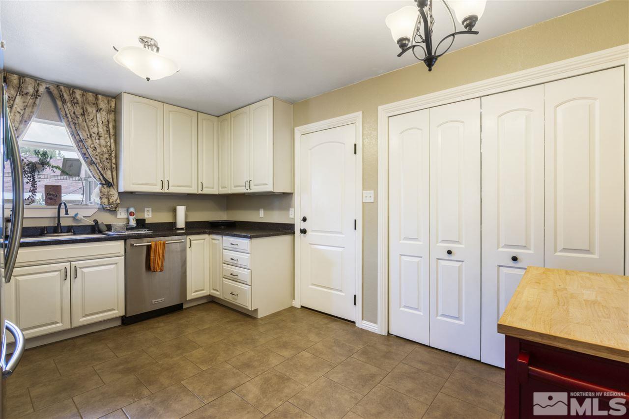 1545 Elizabeth Street Reno, NV 89509 - Photo 9 of 21 a kitchen with white cabinets and white appliances
