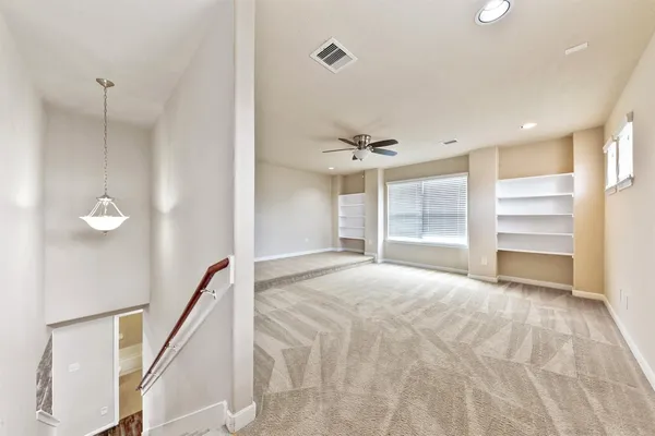 a view of an empty room and window