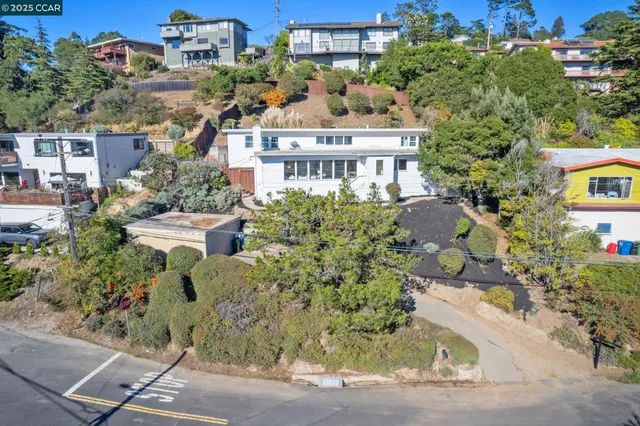 front view of a house with a garden