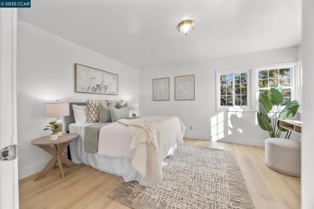 a bedroom with furniture and a rug