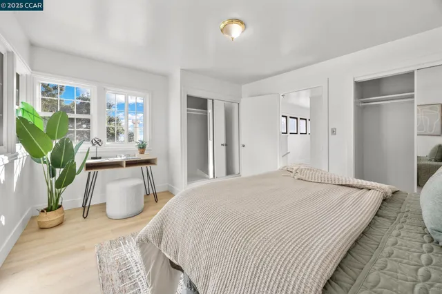 a bedroom with bed and window