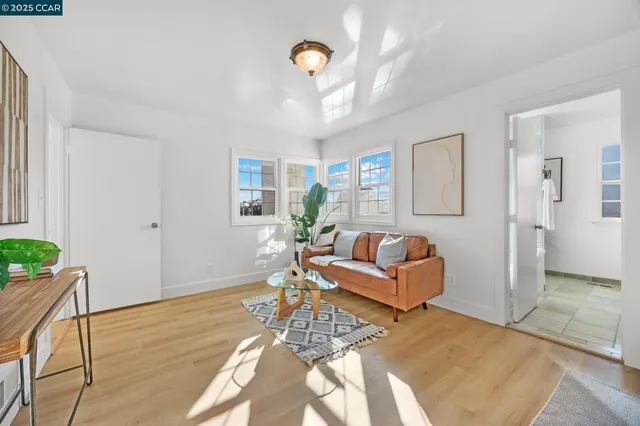 a bedroom with furniture and a chandelier