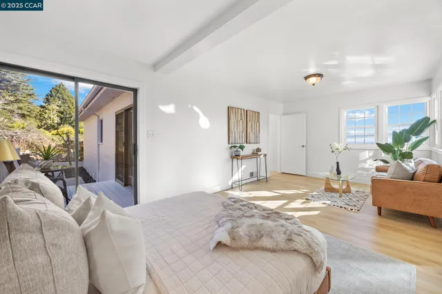 a bedroom with a bed and couch