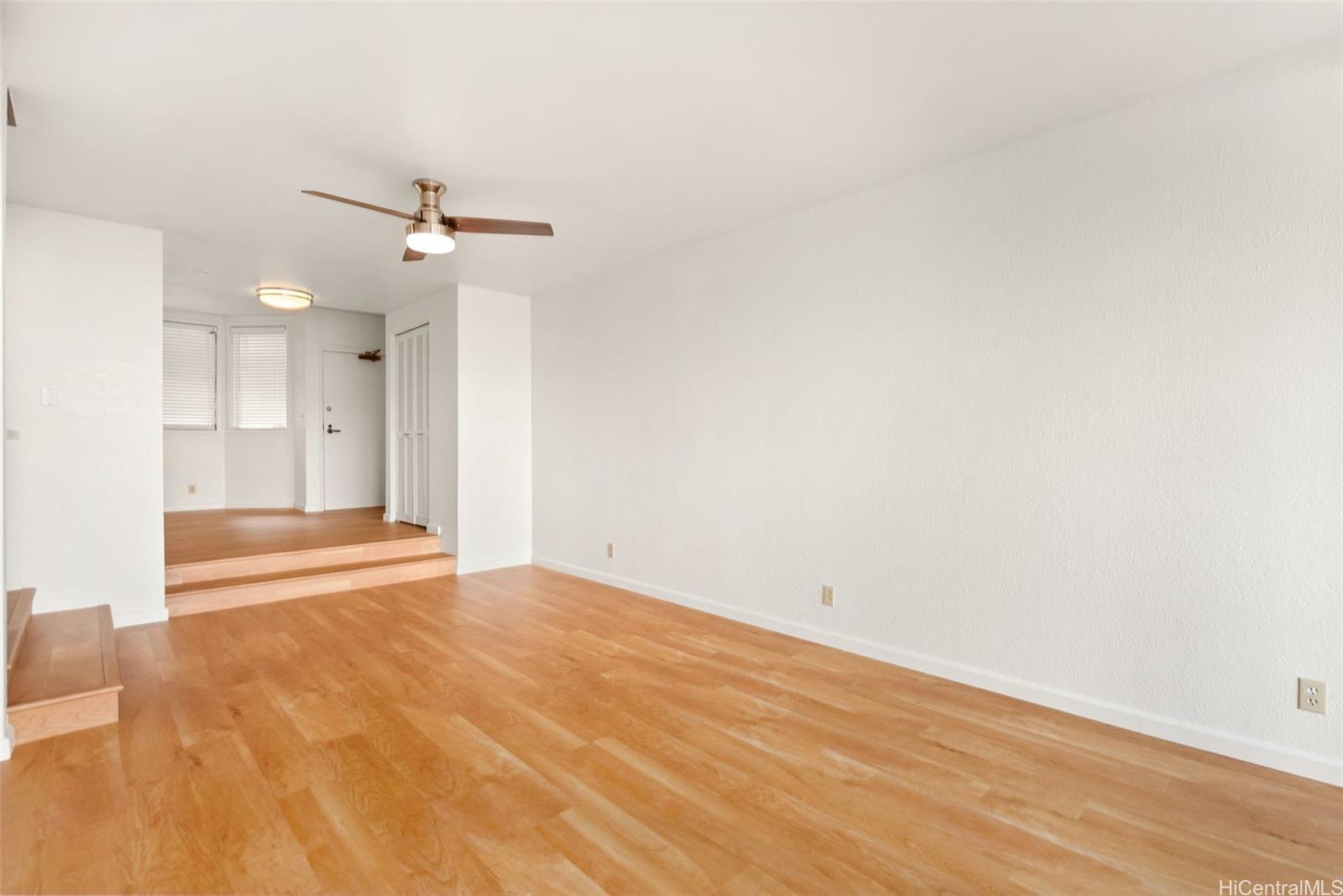 45-315 Lilipuna Road, Unit A204 Kaneohe, HI 96744 - Photo 1 of 1 an empty room with wooden floor and windows