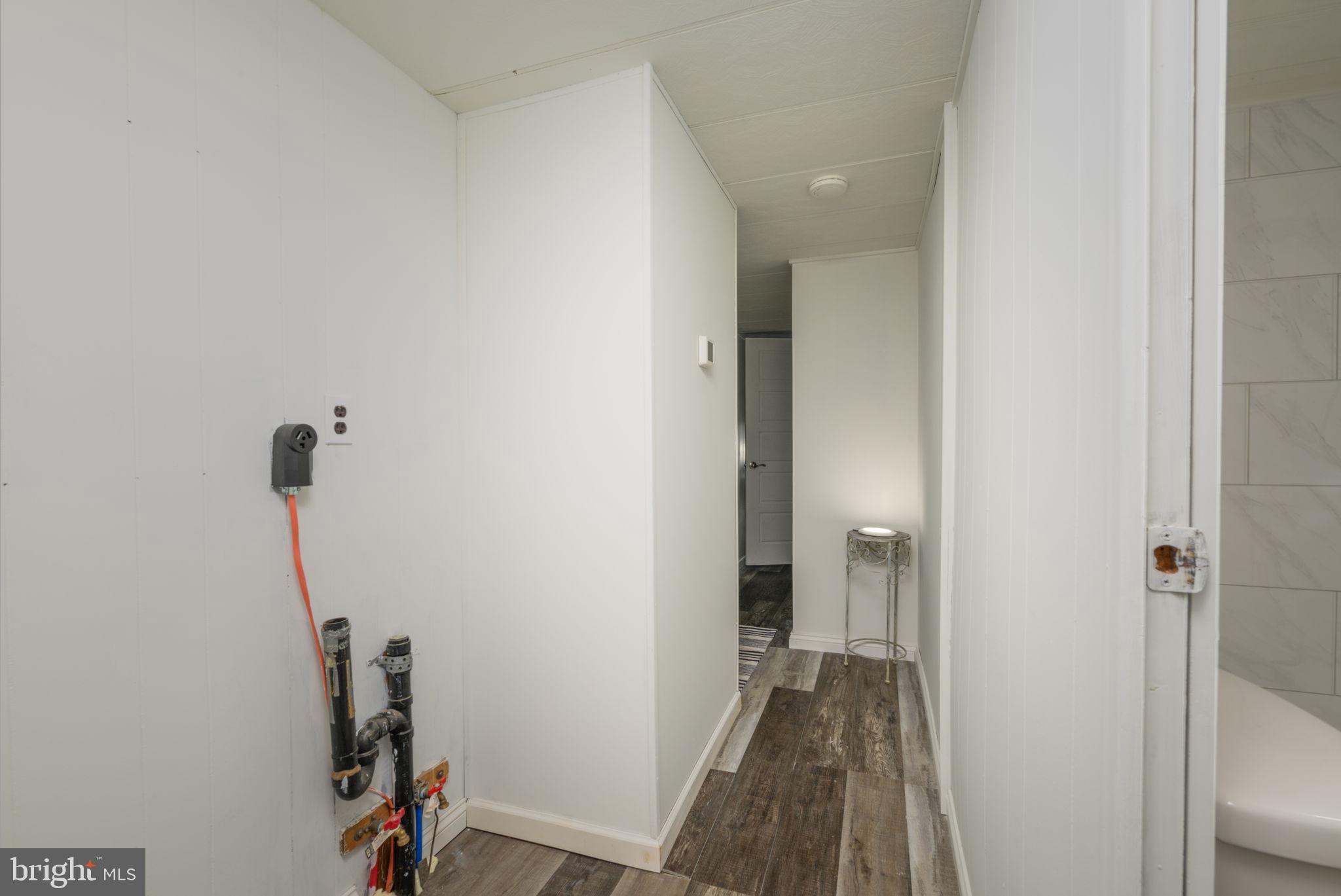 35401 Mallard Road Millsboro, DE 19966 - Photo 17 of 23 a view of a hallway with a room