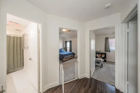a living room with furniture gym equipment and a flat screen tv