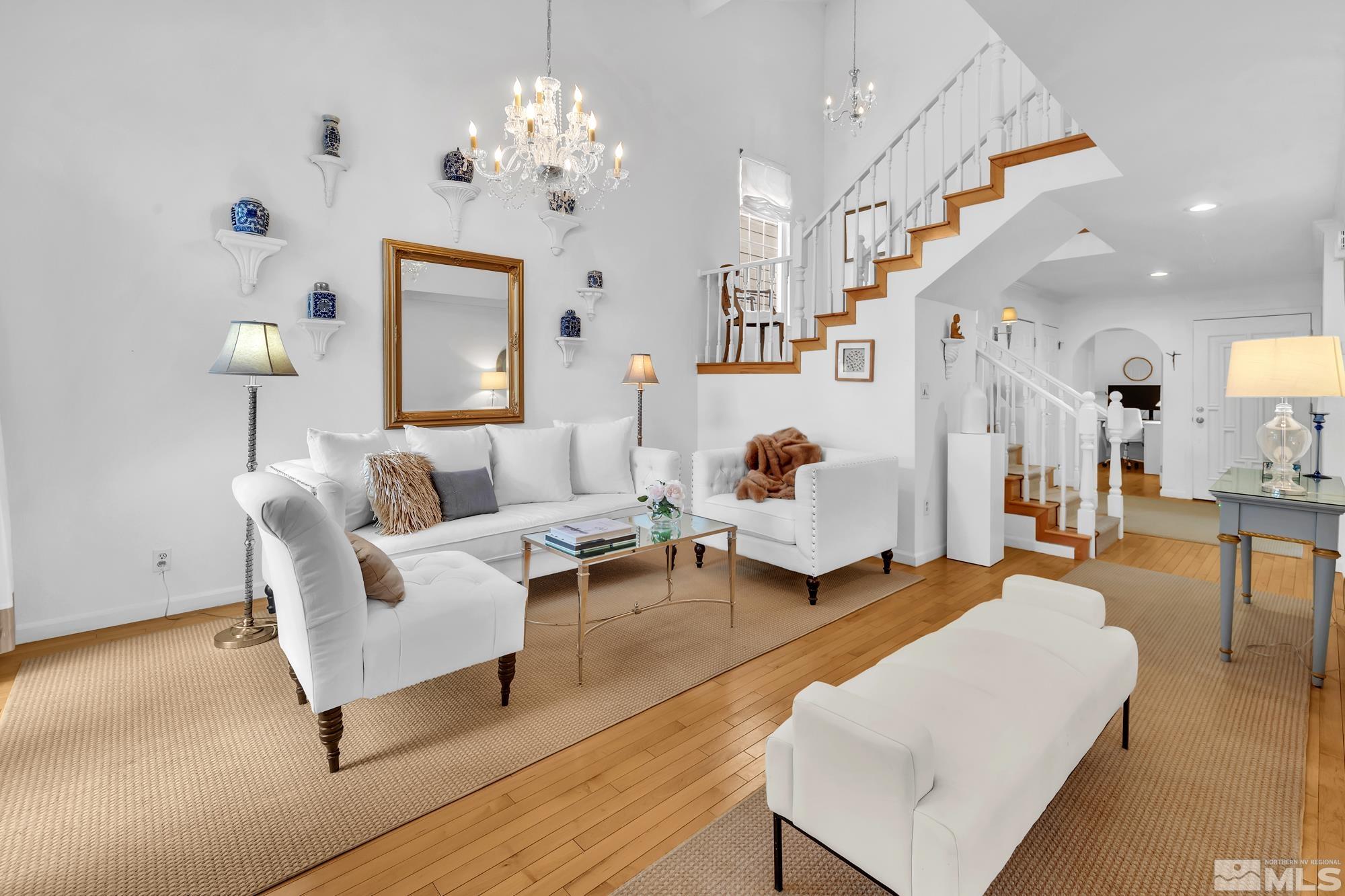 855 Lighthouse Court Reno, NV 89511 - Photo 4 of 40 a living room with furniture and a chandelier