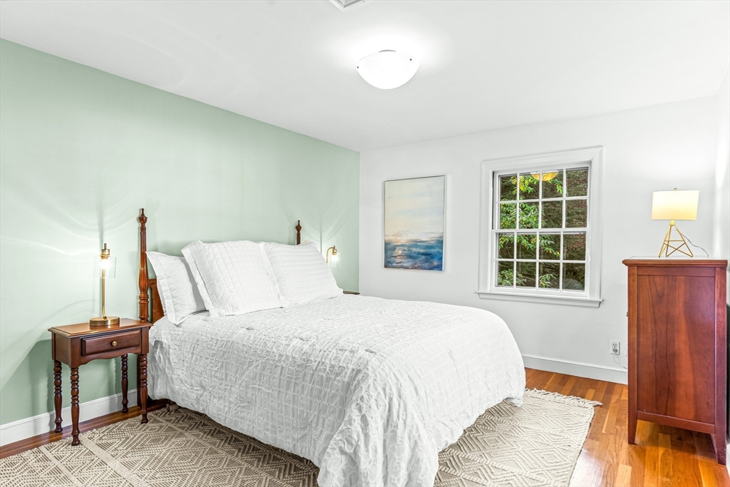111 Pilgrim Road Wellesley, MA 02481 - Photo 13 of 21 a bedroom with a bed a window and potted plant on the dresser