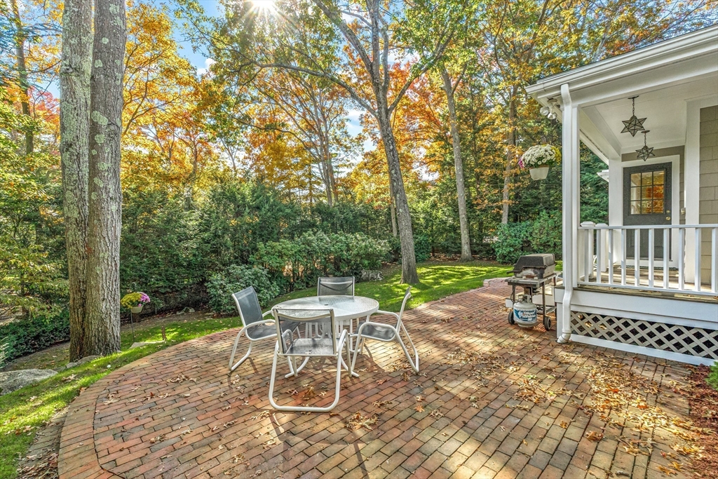 111 Pilgrim Road Wellesley, MA 02481 - Photo 17 of 21 a view of a patio with a table and chairs