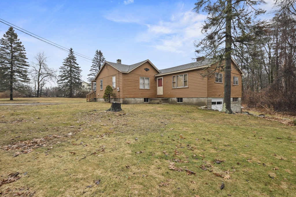 148 Lunenburg Road Townsend, MA 01474 - Photo 4 of 26 a front view of a house with a yard