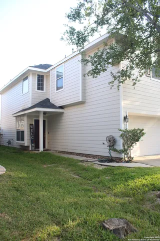 a house view with a garden space