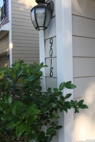 a vase of flowers sitting on a wooden floor