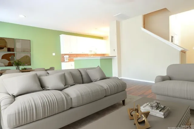 a living room with furniture and a large window