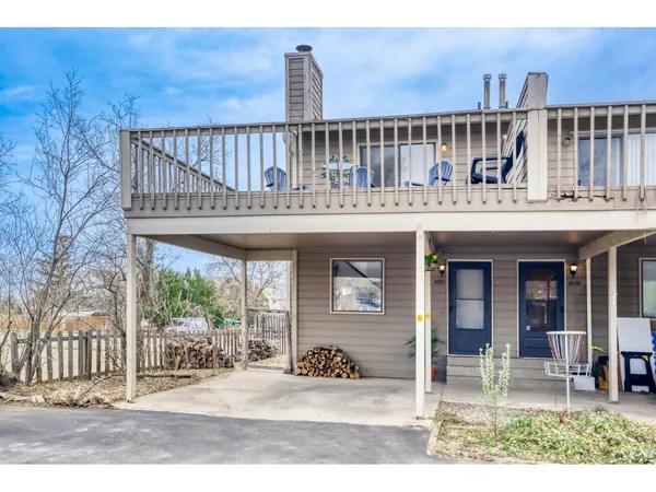 a view of a house with wooden deck