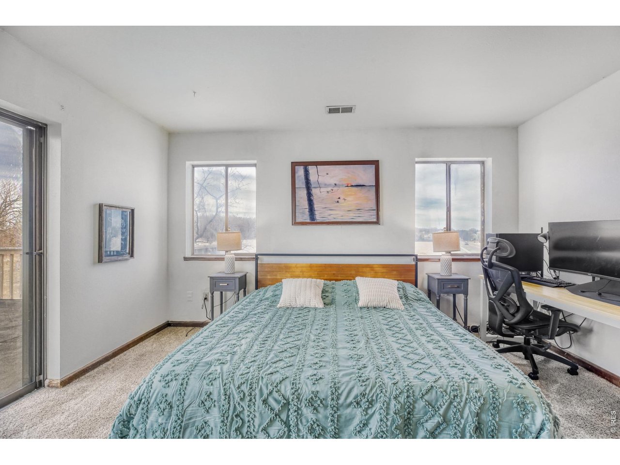 4690 Portside Way Boulder, CO 80301 - Photo 8 of 18 a bedroom with a bed a table and chair