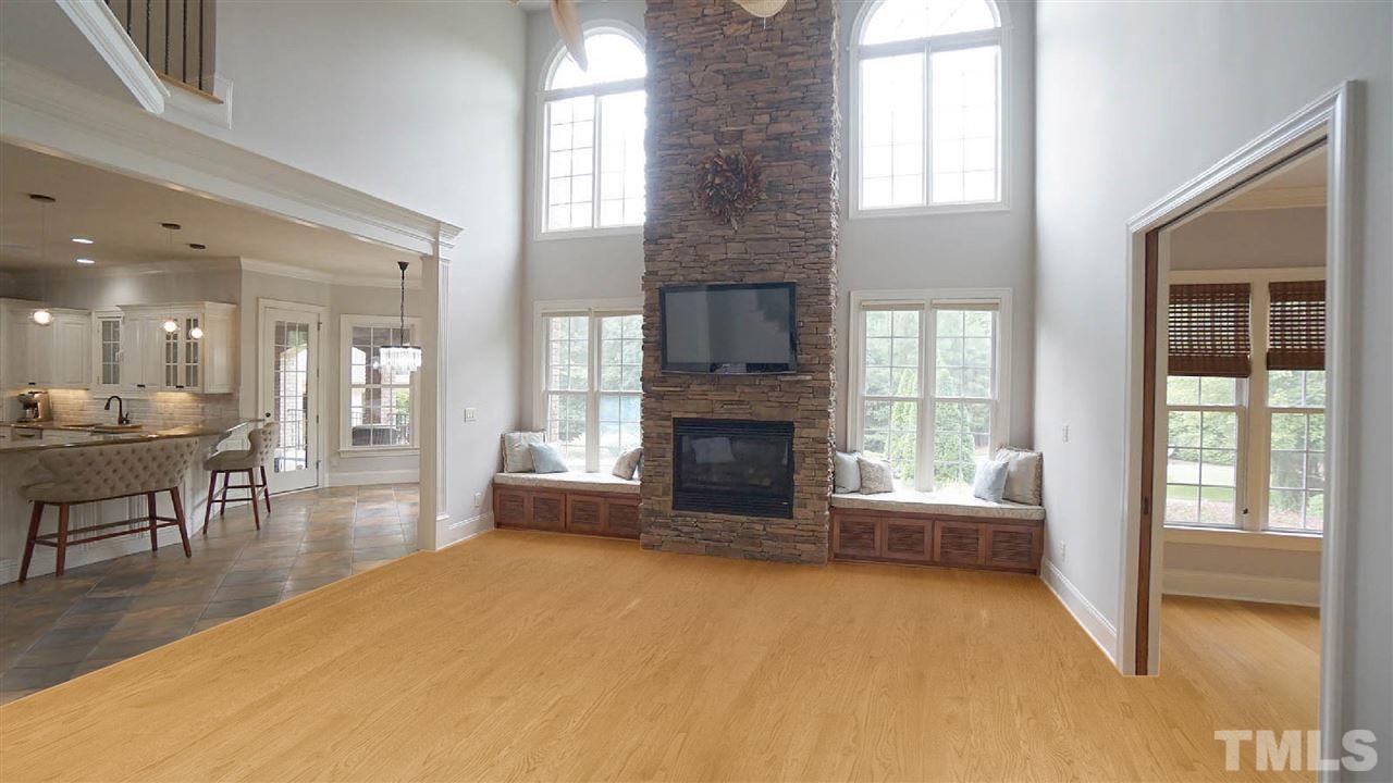 1608 Sharnbrook Court Raleigh, NC 27614 - Photo 13 of 30 Soaring ceilings, floor to ceiling stone fireplace, open to kitchen, overlooking expansive backyard. Bamboo hardwood floors