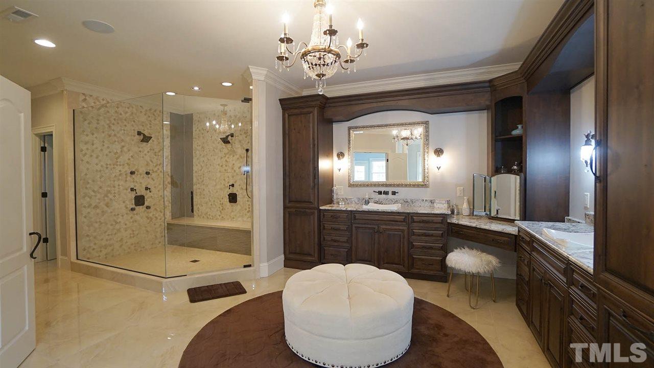 1608 Sharnbrook Court Raleigh, NC 27614 - Photo 16 of 30 Exquisite renovated spa bath w/large tile cultured marble floorings, Oversized granite counters, Custom vanity mirrors, Private water closet, Freestanding soaking tub & oversized walk-in shower w/double shower heads