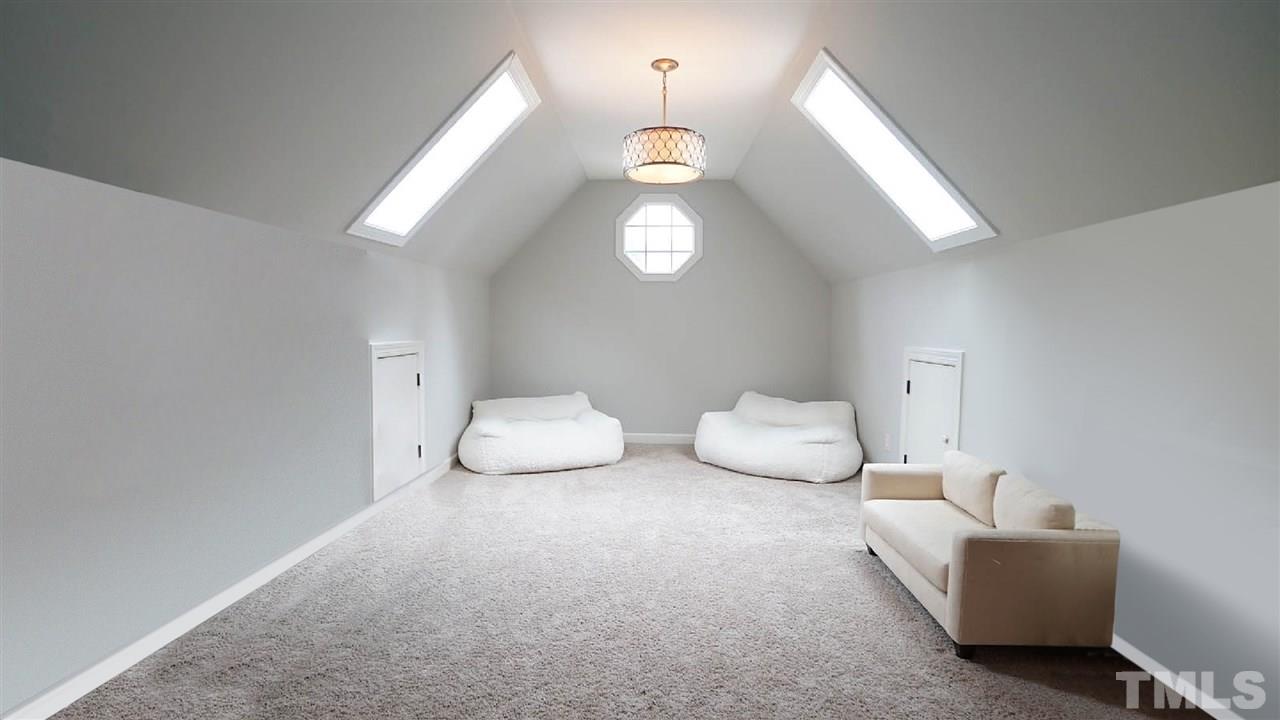 1608 Sharnbrook Court Raleigh, NC 27614 - Photo 20 of 30 Large area that can be separated into two rooms. Kids playroom, exercise, craft room, home school, endless possibilities. Conveniently located bathroom within Bonus Room