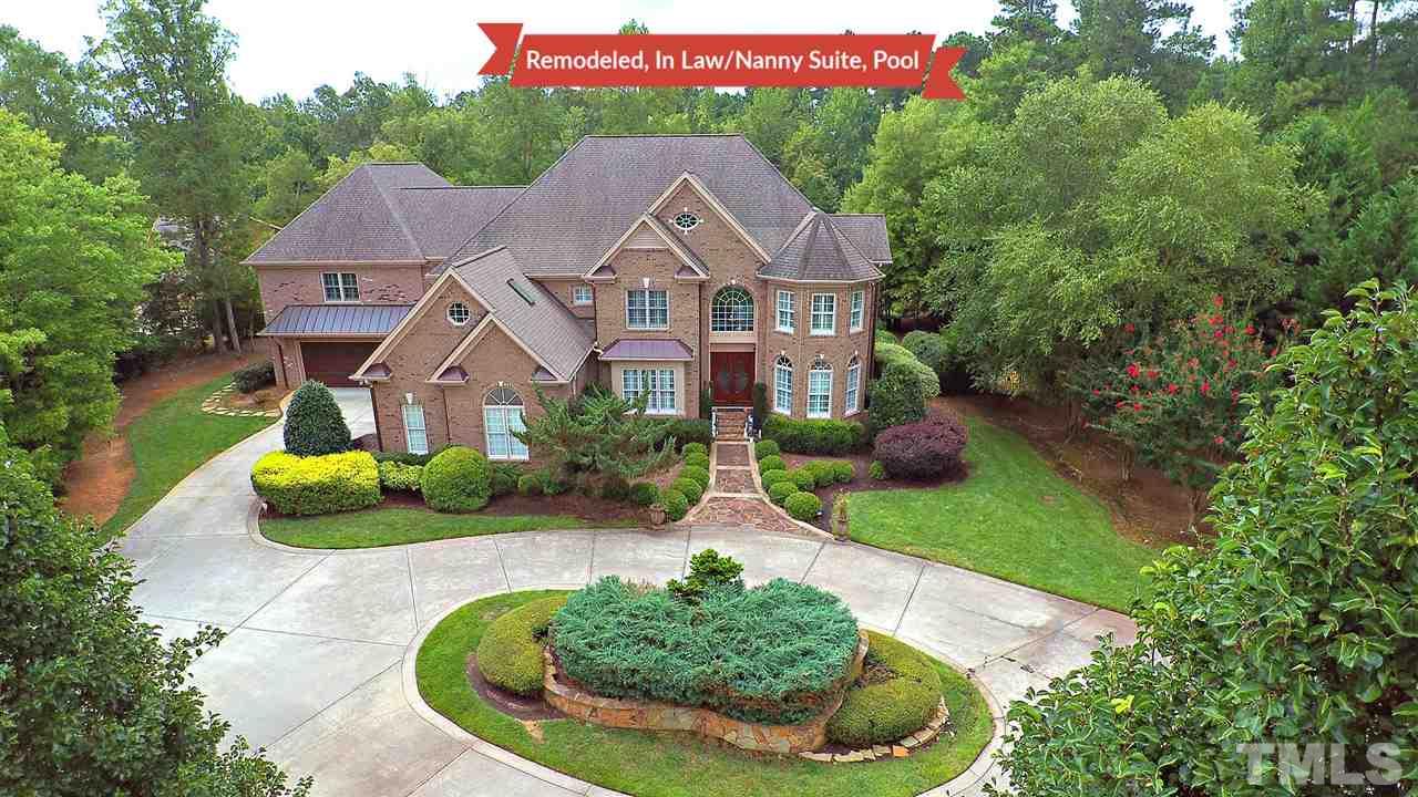 1608 Sharnbrook Court Raleigh, NC 27614 - Photo 3 of 30 All brick private estate, no city taxes, centrally located to shopping & highways. Meticulously manicured yard with privacy, putting range, salt water pool, and outdoor entertaining-can fit large groups