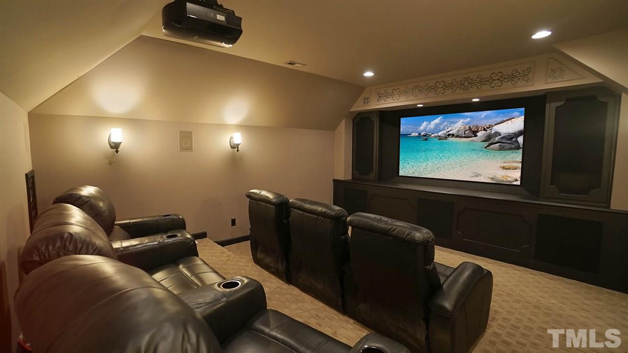 1608 Sharnbrook Court Raleigh, NC 27614 - Photo 22 of 30 Private screening room, w/ oversized screen, projector and audio equipment. Leather theatre seating.