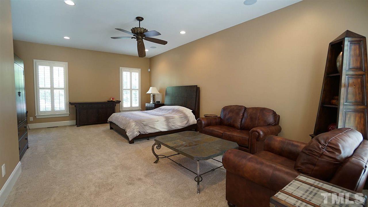 1608 Sharnbrook Court Raleigh, NC 27614 - Photo 28 of 30 Private Guest/Nanny/In-Law suite separate yet still connected to the main house via covered walk way-oversized bedroom and living area, flooded with light and full bathroom with walk in shower