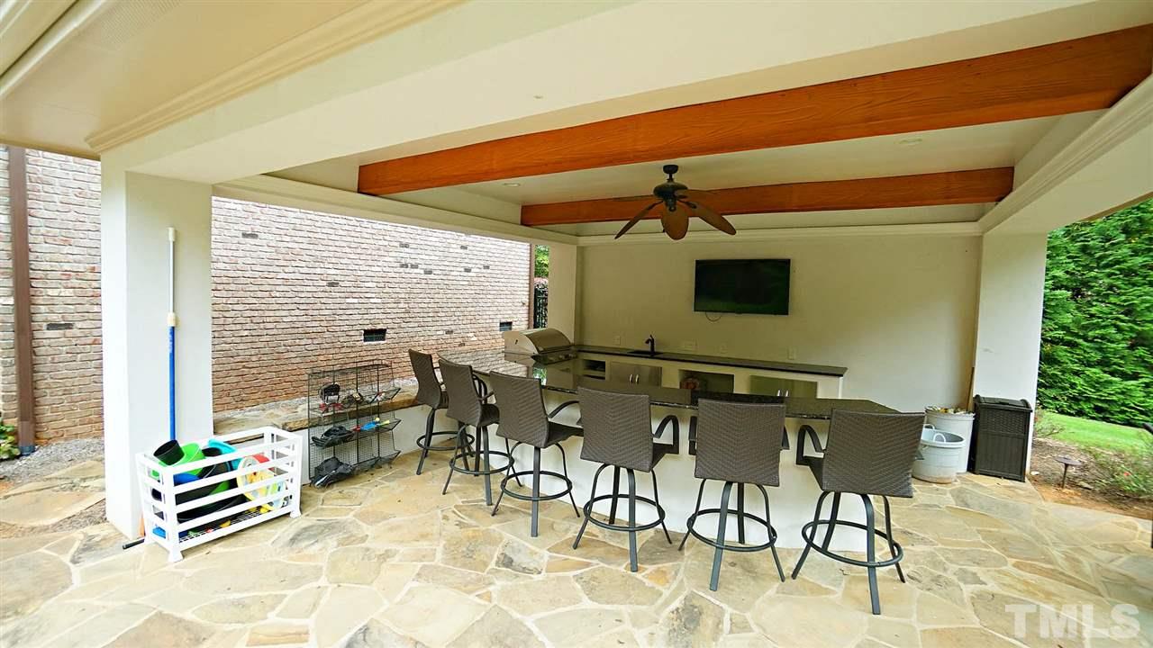 1608 Sharnbrook Court Raleigh, NC 27614 - Photo 7 of 30 Recent addition-Outdoor gazebo kitchen w/oversized granite counters, Grill-Tec infrared grill, 2 beverage fridges, ice maker, & sink