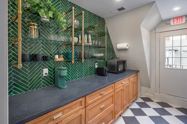 a stairs of a house with wooden floor in front of it