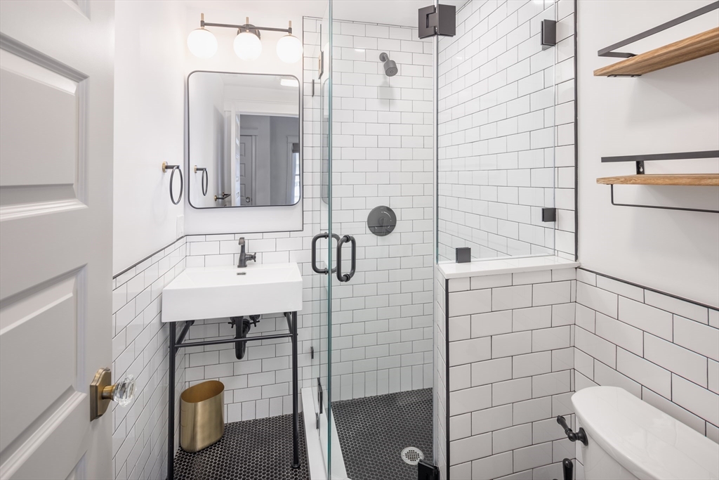 44 Winslow Road Brookline, MA 02446 - Photo 24 of 35 a bathroom with a sink a toilet and shower